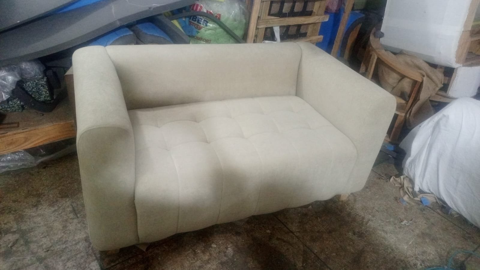 Fabric being fitted to a sofa back
